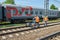 MOSCOW, MAY, 18, 2018: View of railway maintenance workes group with trolley doing rail tracks ultrasonic inspection and visual co