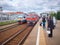 MOSCOW, MAY, 31, 2018: View on city passenger train coming to railway station with waiting people. Russian railways electric passe