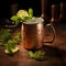 Moscow Mule cocktail in copper mug is garnished with a vibrant lime wedge