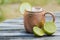 Moscow mule in copper cup with limes