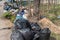 Moscow region, Russia - April 26, 2019: Garbage dump on the side of the road. The problem with the removal and processing of