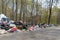 Moscow region, Russia - April 26, 2019: Illegal garbage dump on the roadside. Summer residents  throw trash along the road