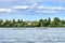 Moscow region, Russia - August 19, 2018. Mature couple riding on stand up paddle boards on the lake water in summer