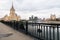 The Moscow River and its embankments. View from the Novoarbatskiy bridge. Famous skyscraper of the former Soviet hotel `Ukraine`.