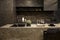 MOSCOW / RUSSIA - 04/03/2019 luxurious spacious modern kitchen island in black grey brown stone marble tones, a sink, a