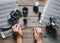 Moscow. Russia - 04 23 2020: top view of woman hands, photographer with analog cameras, film, lenses on old wooden table