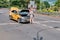 Moscow Russia 06 10 2019: Driver Yandex taxi saves pouring water from the bottle to cool the engine. Problems of overheating and