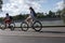 MOSCOW, RUSSIA - 06.20.2018: Two biker girls in Gorky Park moving on their velocipedes in sunny day