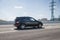 Moscow  Russia - 19 April 2019  black mercedes benz ml w164 parked on highway overpass near city. Clearsky.