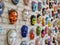 Moscow, Russia, 21 October 2019: Colorful painted ceramic faces sculpture on the bricks wall as an the object of modern