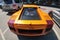 Moscow, Russia - April 14, 2019: Bright orange Lamborghini Gallardo with carbon hood and other parts parked on the street near