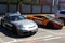 Moscow, Russia - April 14, 2019: exclusive Porsche 911 with aerography and Mansory tuning near bright orange Lamborghini Gallardo