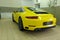 Moscow, Russia - April 14, 2019: Porsche 911 Carrera wrapped in bright yellow film, Service and detailing center