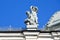 Moscow, Russia, April, 15, 2017. Fragment of the sculptural composition of putti frolicking babies on the roof of the main buildin