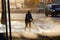 MOSCOW, RUSSIA,APRIL,2.2019:Worker cleans the road from dirt powerful stream of water from the hose