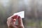 MOSCOW, RUSSIA - APRIL 22, 2018: A paper airplane in his hand. Action to launch aircraft in support of the Telegram app