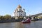 Moscow, Russia - April 29, 2019: River pleasure boat on the Moscow River, Patriarchal pedestrian bridge