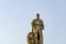 Moscow, Russia, April 30, 2019: View of golden monument Worker, blue sky on VDNH
