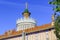 Moscow, Russia - August 01, 2018: Roof of pavilion Ukrainian SSR with gilded spire with soviet star against blue sky and green tre