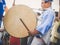 Moscow, Russia - August 09, 2018: Japanese artist perform at Bon Festival in blue kimono with big drum odaiko on