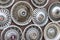 Moscow, Russia - August 11, 2019: Wall collection of vintage rusty automobile hubcaps of retro cars