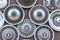 Moscow, Russia - August 11, 2019: Wall collection of vintage rusty automobile hubcaps of retro cars