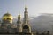 MOSCOW, RUSSIA - AUGUST, 2017 - white crescent moon and domes of the Moscow Cathedral Mosque in the evening reflect sunlight.