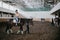 Moscow, Russia - August 2019: Horses and visitors to the equestrian base, horseback riding