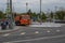 Moscow, Russia - August 24, 2020: Big orange Kamaz watering the city street. City street cleaning, watering machine