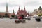 Moscow, Russia - August 24, 2020: Red Square, Nikolskaya Tower and Historical Museum. A black and red forklift transports metal