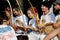 Moscow, Russia, August 26, 2018: young people play berimbau musical instruments, accompanying the martial art of Capoeira in front