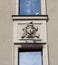 Moscow, Russia-August 8, 2020. The building of the famous Vakhtangov theater. Bas-relief of the jester between the floors. Pigeons