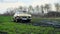 Moscow, Russia - CIRCA 2020: beige retro vintage old car GAZ M-21 made in USSR stuck in a swamp on a muddy wet road and