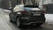 Moscow, Russia - CIRCA 2020: Large green SUV Lexus RX driving on the road in winter, rear view of the trunk and