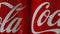 MOSCOW, RUSSIA- CIRCA MARCH 2018: Cans of famous american sort drink with Coca-Cola logo rotating