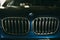 Moscow. Russia - December 06, 2019: Close up of frontal part, headlights and frill The all-new BMW X3. Blue crossover stands on