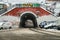 Moscow, Russia - December 08, 2018. Old archway covered with graffiti with tram rails in winter