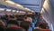 Moscow, Russia December 18, 2019: The rear view of the many people on the plane. Interior of airplane with passengers