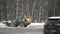 Moscow, Russia- december 2021: Yellow snow plow removes snow after heavy snowfall in the city during the day