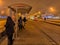 Moscow/Russia. December 26, 2019. Trams in the fog lit by a network of LEDs arrive at a bus stop with passengers. Environmentally