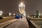 Moscow, Russia - December 7, 2022: Blue bus drives down a snowy street in a cold and deserted Moscow in winter