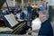 MOSCOW, RUSSIA. The elderly man plays on grand pianos in the waiting room of the Yaroslavl station