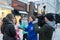 Moscow, Russia - February 11, 2018. Correspondent of TV and radio company Mir takes interview with passers-by on Old Arbat