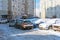 Moscow, Russia - February 18, 2021: Snow-covered cars after heavy snowfall in Moscow. A road in a residential area after a heavy