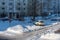Moscow, Russia - February 18, 2021: Snow-covered cars after heavy snowfall in Moscow. A road in a residential area after a heavy