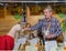 Moscow, Russia - February 25, 2017: Salesman at the fair offers to try home produced honey from his showcase