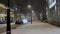 Moscow, Russia, January 2018: Night blizzard in the city. The city center, old buildings, car traffic, people walking in the dista