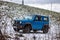 Moscow, Russia - January 24, 2020: Blue mini SUV Suzuki Jimny in winter