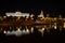 Moscow, Russia - July, 17 2016: View of the Moscow Kremlin at night with reflection in the river and the shadow of the ship