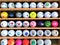 Moscow, Russia, July 2019: Collection of multi-colored Golf balls with different logos, which stand on the shelves in a special